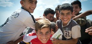 Boys playing in the Essyan Camp for Yazidi refugees